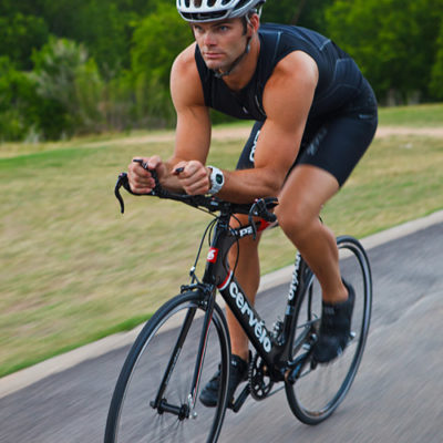 male triathlete on bike